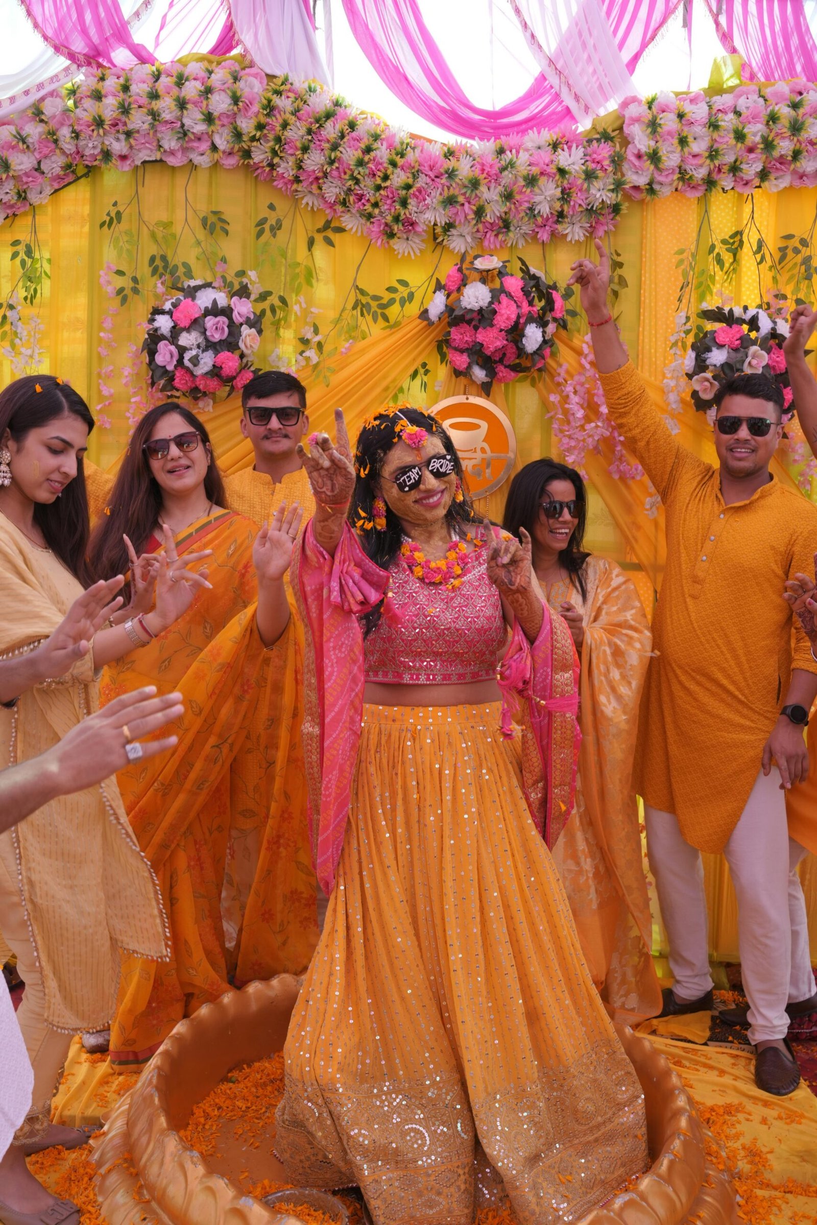 A joyful Indian Haldi ceremony with vibrant colors and traditional attire.